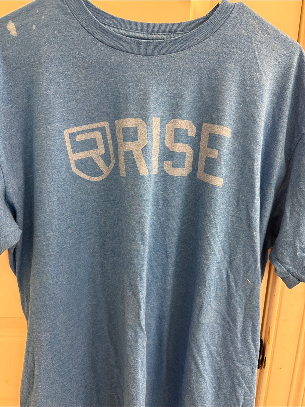 Logo Blue Men's Short-Sleeve T-Shirt. Has a small stain on the right side seepic
